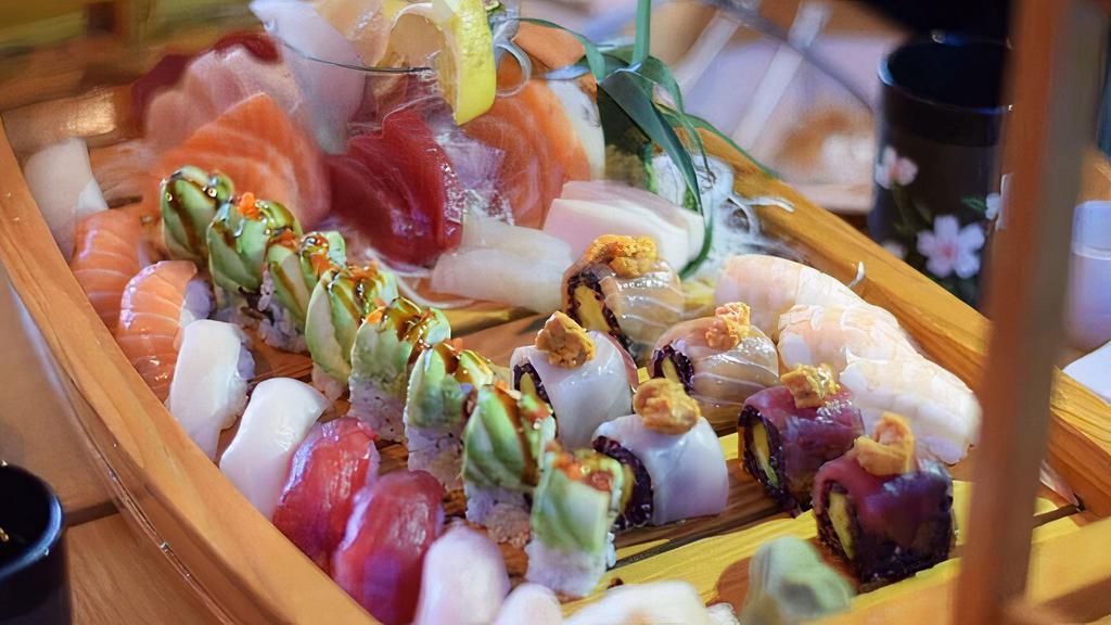 Love Boat · 10 pcs. sushi, 18 pcs. sashimi, California roll & dragon roll.