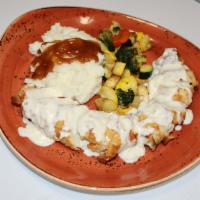 Pollo Firenze · (Chicken breast stuffed with spinach and 3 cheese topped with special cream sauce served wit...