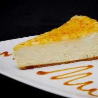 Creme Brulee · Vanilla New York Style Cheesecake with a graham cracker crust and a burnt caramel top.