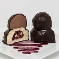 Coco Tartufo · A double decker Ice cream Truffle, vanilla and chocolate ice cream with a raspberry and almo...
