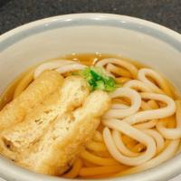 Kake Udon · Udon noodle in mildly flavoured dashi broth topped with deep fried thin tofu and chopped gre...