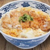 Katsu Don · Bowl of rice topped with deep fried pork cutlet simmered in umami-dashi based broth with mis...