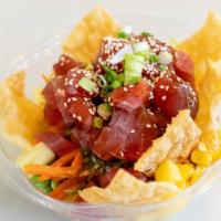 Tuna Poke Bowl · Fresh tuna tossed in teriyaki-ginger dressing, corn, edamame, cucumbers, seaweed salad, mang...