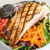 Grilled Salmon · served overs romaine lettuce, onions, cucumbers and tomato salad with white balsamic dressing