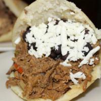 Arepa Pabellon · Shredded beef, black beans, grated white cheese, and fried sweet plantains.