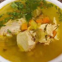 Sopa De Pollo · Chicken soup comes with a plain arepa or white rice.