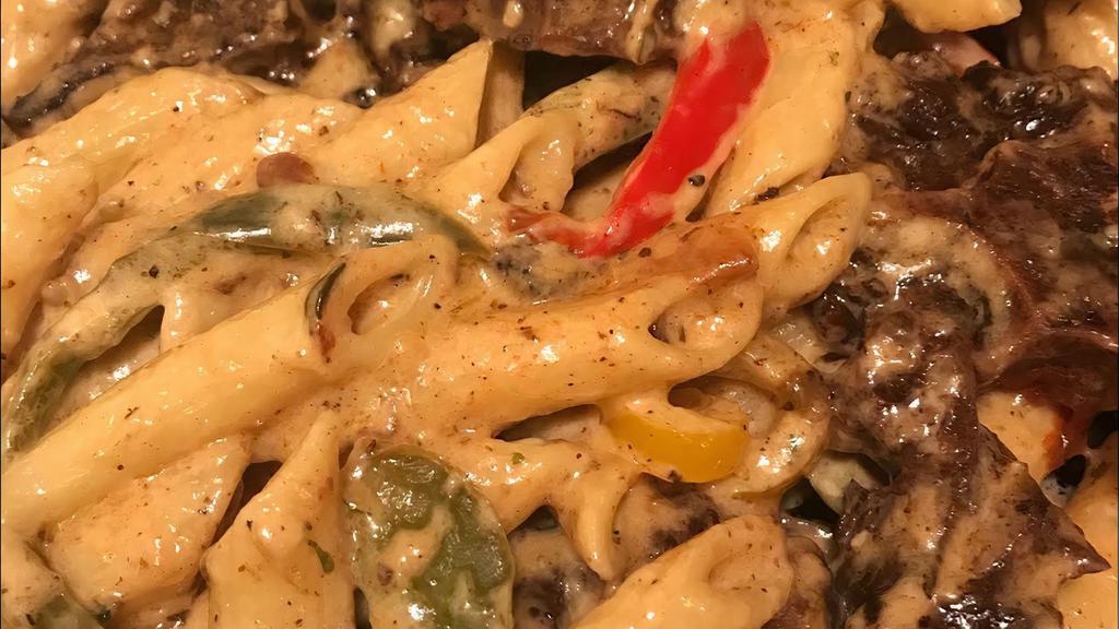 Rasta Pasta (Oxtail) · PENNE PASTA, RED PEPPERS, GREEN PEPPERS, PARMESAN CHEESE, CREAM ;LOADED WITH OXTAIL