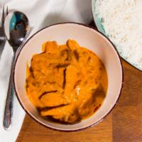 Butter Chicken · Succulent pieces of chicken cooked in rich tomato sauce with herbs, spices, and a touch of b...