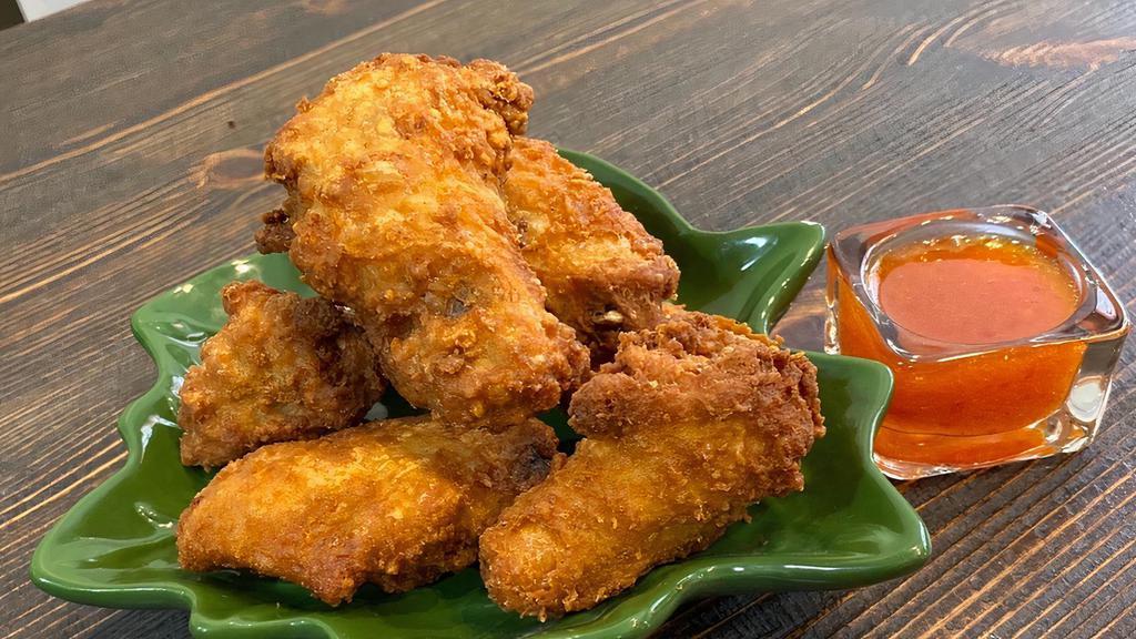 Thai Wings · Spicy. Most popular. Fried chicken wings served with Thai sweet chili sauce.