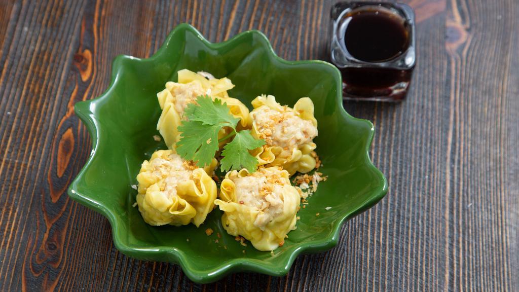 Steamed Dumpling · Chicken and shrimp dumpling with soy-vinaigrette dipping sauce.