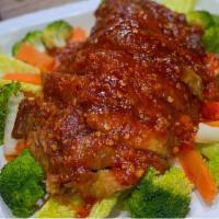 2 Three Flavor Duck · Spicy. Crispy boneless half duck topped with chef's special  spicy hot and sour sauce