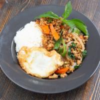 Sp10. Thai Style Chicken Basil With Fried Egg · Spicy. Sautéed ground chicken, garlic, onion, baby corn, carrot, long hot chili, basil, and ...