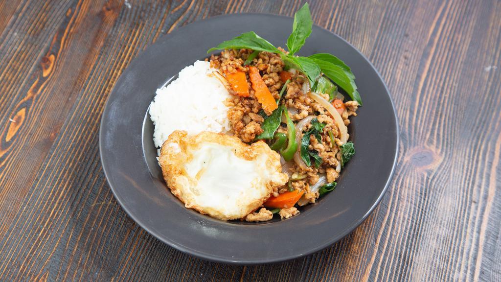 Sp10. Thai Style Chicken Basil With Fried Egg · Spicy. Sautéed ground chicken, garlic, onion, baby corn, carrot, long hot chili, basil, and Thai chili with fried egg on top served over rice.