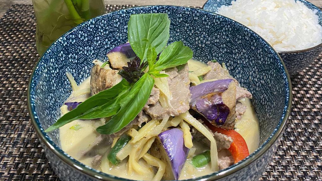 Green Curry · Spicy. Hot and lightly sweet coconut-based curry with bamboo shoots, string beans, bell pepper, eggplant and basil.