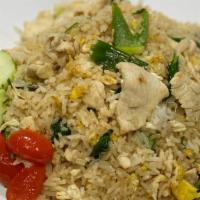 Classic Thai Fried Rice · Fried rice with egg, onion, scallions, tomato, Chinese broccoli in lightly thin soy sauce.