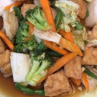 Tofu Delight · Vegan. Sautéed tofu and mixed vegetables with brown garlic sauce. Served with jasmine rice.