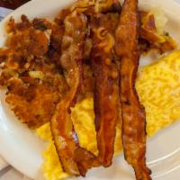 Hungry Man Platter · Three eggs any style, bacon, sausage, ham, homefries, toast (white, whole wheat, or rye brea...