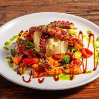 Grilled Octopus · Served over mashed potatoes and grilled vegetables.