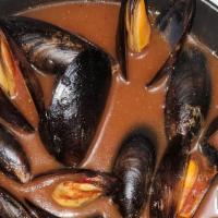 Mussels · Onions, garlic, cooked in a spicy tomato sauce.