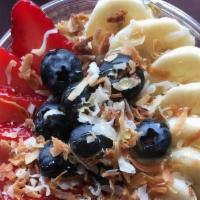 Acai Bowl · Topped with blueberries, strawberries, bananas, granola, honey, and toasted coconut.