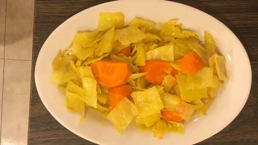Tikel Gomen (Cabbage) · Fresh cabbage sautéed with onions, garlic, carrots and turmeric.