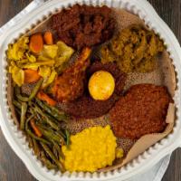 Addis Special · Chicken, beef, lamb and choice of your own four vegetable sides. You can choose from: cabbag...