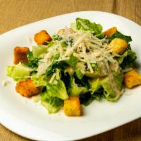 Caesar Salad · Hearts of romaine lettuce, shaved Parmesan cheese and croutons.