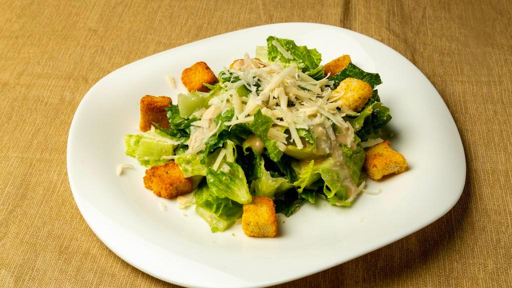 Caesar Salad · Hearts of romaine lettuce, shaved Parmesan cheese and croutons.