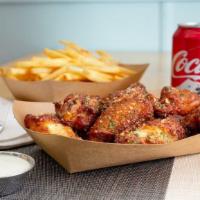  8 Classic Bone-In Wings Combo · 8 Classic bone-in chicken wings tossed with 1 wing flavor and served with fresh carrot & cel...