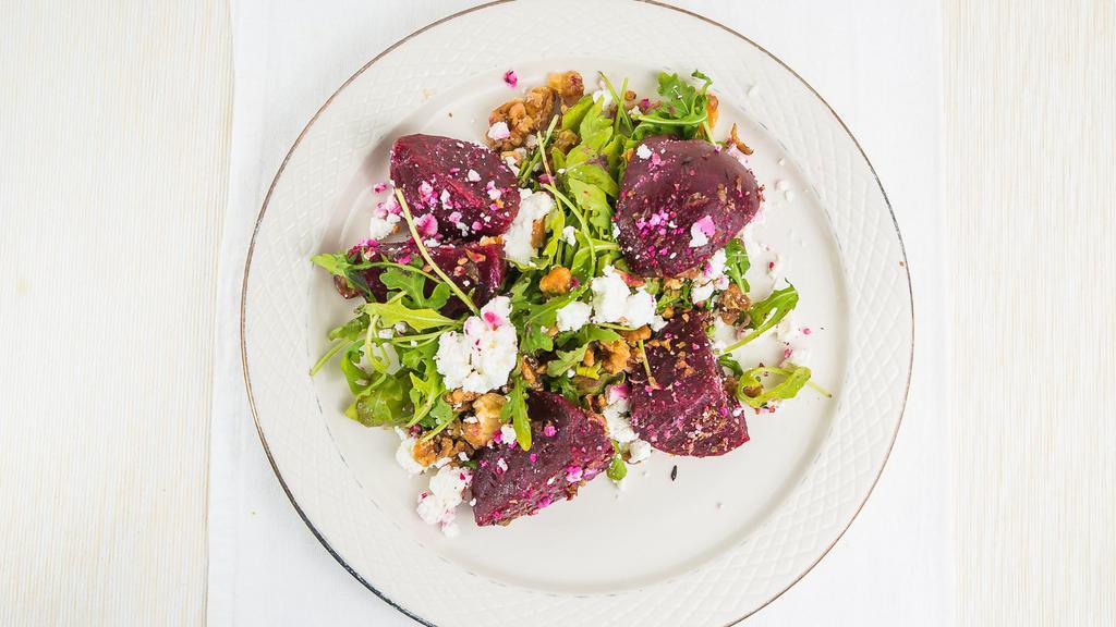 Beets Salad · Mixed Greens, Beets on Sherry Dressing, Goat cheese , Walnuts,and Lemon Vinaigrette on the side.
