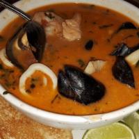 Sopa De Mariscos · Sea food soup with shrimp, mussels, clams, calamari & fish with basil.