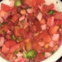 Chirmol · Diced tomato, radish, scallions, red onions, cilantro & lime juice.