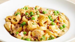 Carbonara Pasta · Bacon, Onions & Peas in a Parmesan Cream Sauce with Your Choice of Pasta.