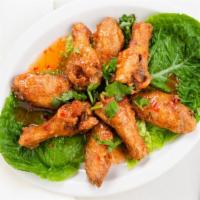 Thai Buffalo Wings · Chicken wings marinated with house special sauce. Deep fry to gold brown, served with sweet ...