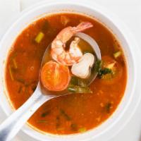 Tom Yum Soup · Hot and sour lemongrass soup, prepared with mushrooms, parsley, Thai ginger, and kaffir lime...