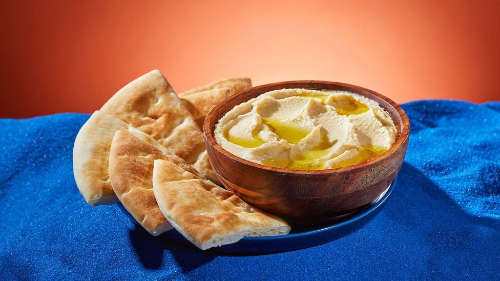 Hummus And Pita · Classic hummus with chickpeas, tahini, lemon juice, and olive oil. Served with pita.