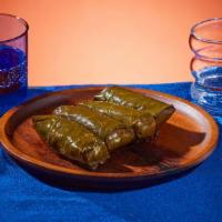 Vegetarian Stuffed Grape Leaves (4Pc) · Soft grape leaves stuffed with rice and herbs.