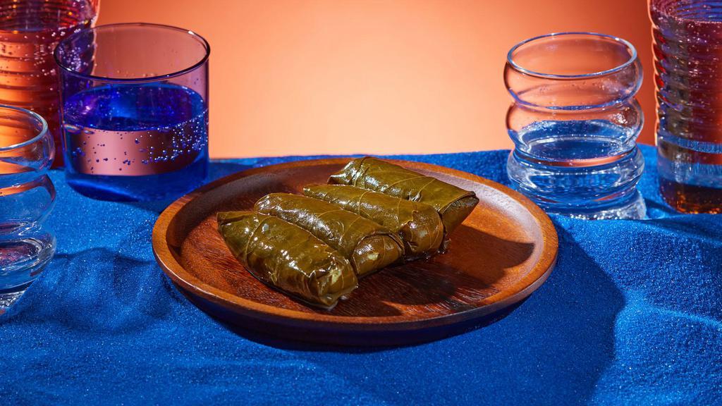 Vegetarian Stuffed Grape Leaves (4Pc) · Soft grape leaves stuffed with rice and herbs.