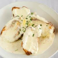 Chicken Cordon Bleu · Chicken cutlet stuffed with ham and swiss, breaded and fried, topped with creamy Alfredo sau...