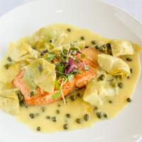Salmon Picatta · Grilled salmon in a lemon, butter and wine sauce. With sautéed capers and artichokes.