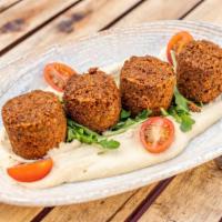 Falafel Platter · Deep fried and seasoned mashed chickpeas served with hummus and house salad.