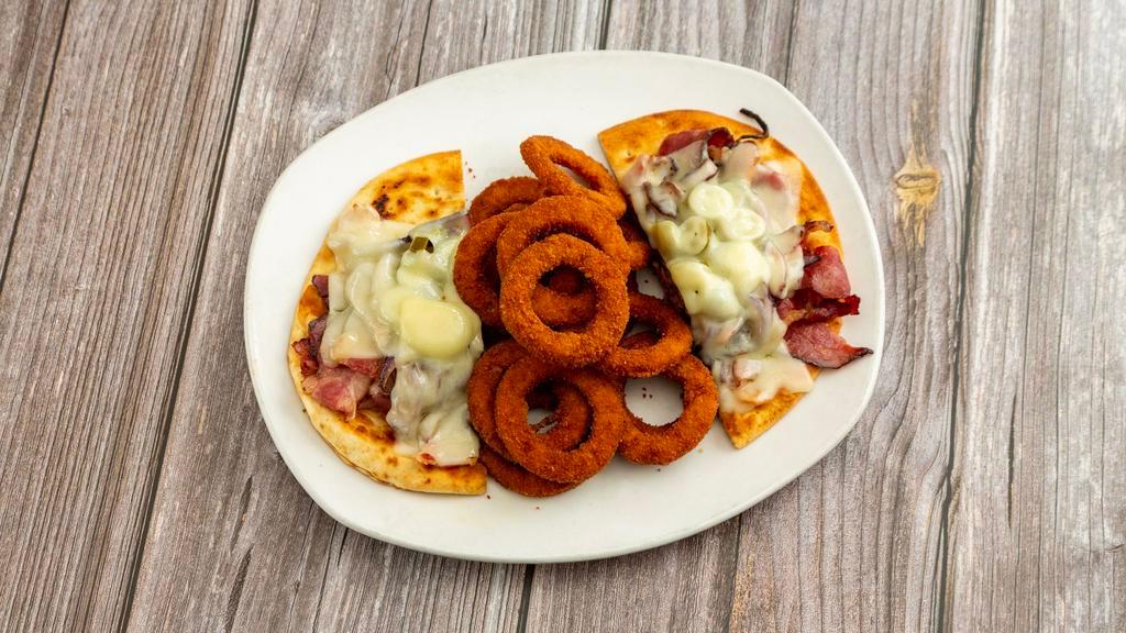 Robert De Niro Platter · Pastrami with melted Swiss, fried onions and hot peppers on pita bread. Served with onion rings.