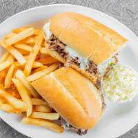 Philly Cheesesteak · Sliced steak with grilled peppers and onions on a hoagie roll. Served with French fries.