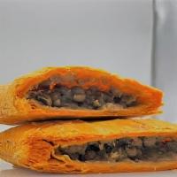 Lentil Jamaican Patty · A savory lentil patty wrapped in flaky layers of our signature Jamaican patty crust.