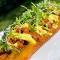 Sweet Plantain Boat · Ripe sweet plantain boat fried to perfection topped with our Vegan beef, Queso and Microgree...