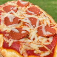 Flatbread Pepperoni Pizza · Vegan mozzarella cheese, vegan seitan pepperoni, organic pizza tomato sauce on a   soft whea...