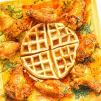 Chicken And Waffles · Freshly made belgian waffles served with golden fried chicken or jerk chicken (waffle syrup ...