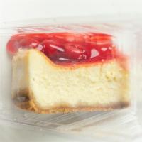 Strawberry Cheese Cake · A tasty dessert with graham cracker crust and topped with homemade strawberries/sauce.