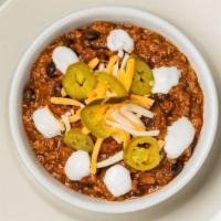 Southwestern Style Chili · Ground beef chili with black beans, jalapenos, shredded cheese and sour cream.