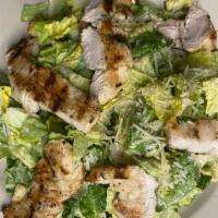 Side Caesar Salad · Romaine lettuce, Parmesan cheese, homemade Caesar dressing and crispy croutons.
